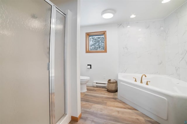9505 Buskey Bay Dr, Iron River, WI 54847 - full bath with baseboard heating, a shower stall, a bath, wood finished floors, and recessed lighting