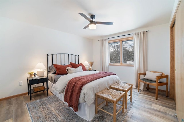 9505 Buskey Bay Dr, Iron River, WI 54847 - bedroom with light wood-type flooring and ceiling fan