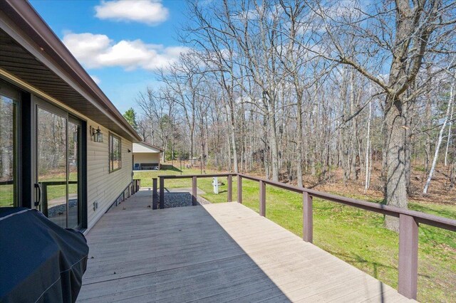9505 Buskey Bay Dr, Iron River, WI 54847 - deck with a lawn and a grill