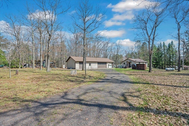 9505 Buskey Bay Dr, Iron River, WI 54847 - view of front of home with a garage and driveway