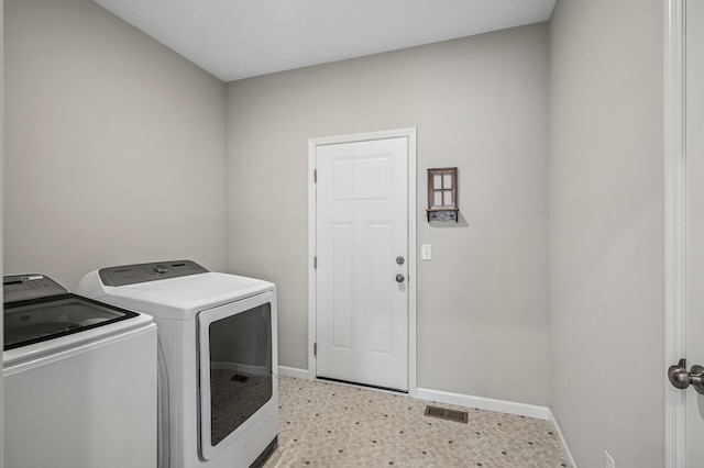 laundry room featuring visible vents, baseboards, independent washer and dryer, and laundry area