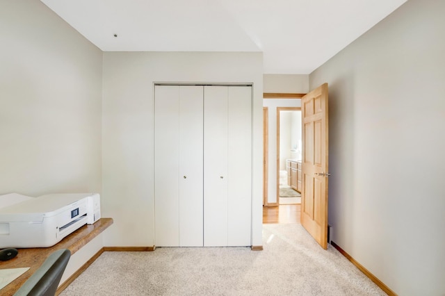 carpeted bedroom with a closet