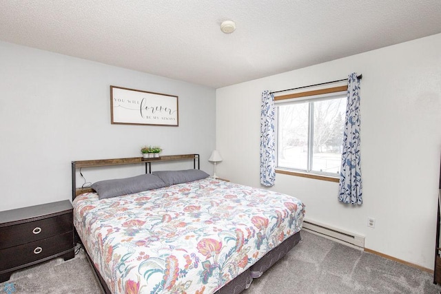 bedroom with a baseboard radiator, light colored carpet, and a textured ceiling