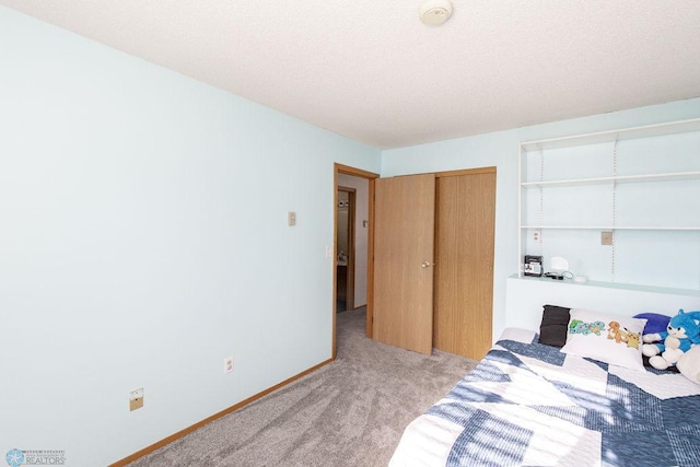 carpeted bedroom featuring a closet