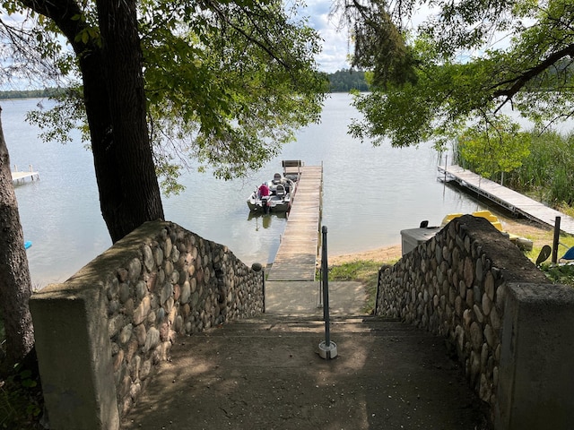 dock area with a water view