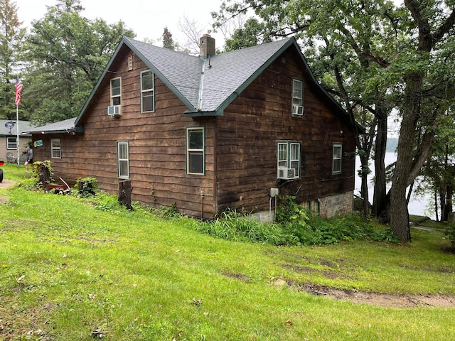 view of side of property featuring a yard