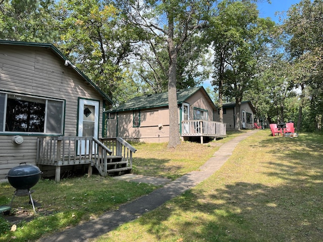 view of yard with an outdoor structure and a deck