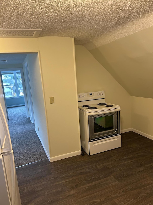 kitchen with white electric stove, vaulted ceiling, and dark hardwood / wood-style floors