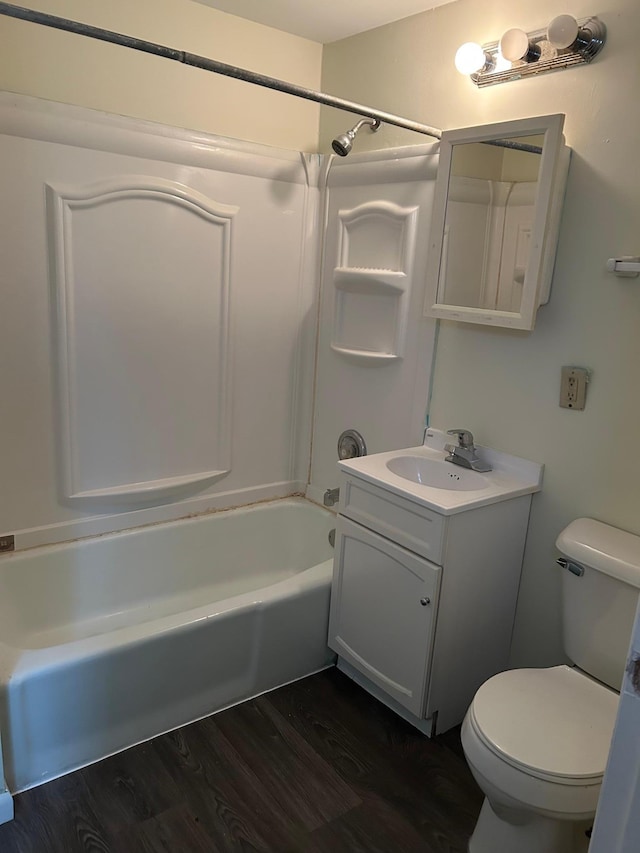 full bathroom featuring hardwood / wood-style flooring, vanity, shower / bath combination, and toilet