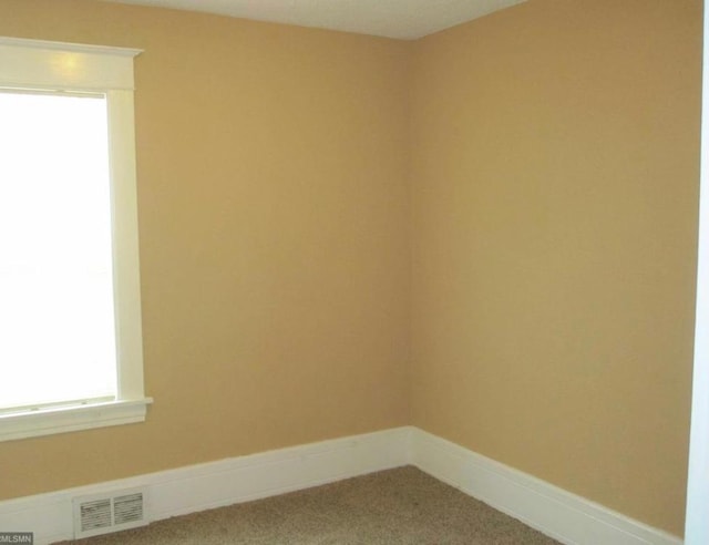 spare room with carpet flooring