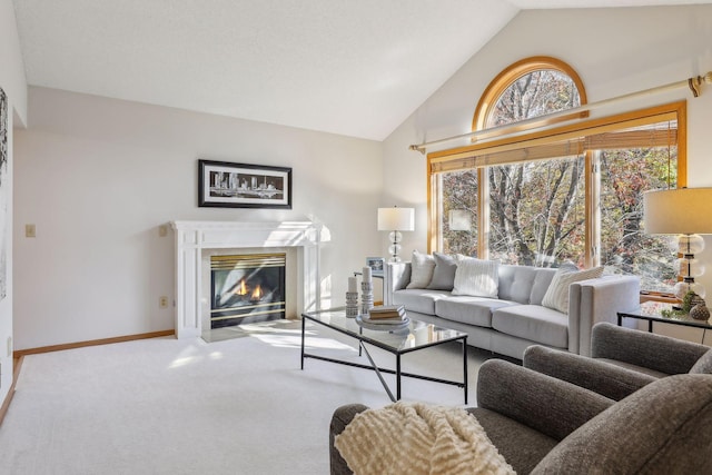 carpeted living room featuring vaulted ceiling