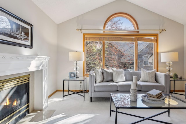 carpeted living room featuring vaulted ceiling