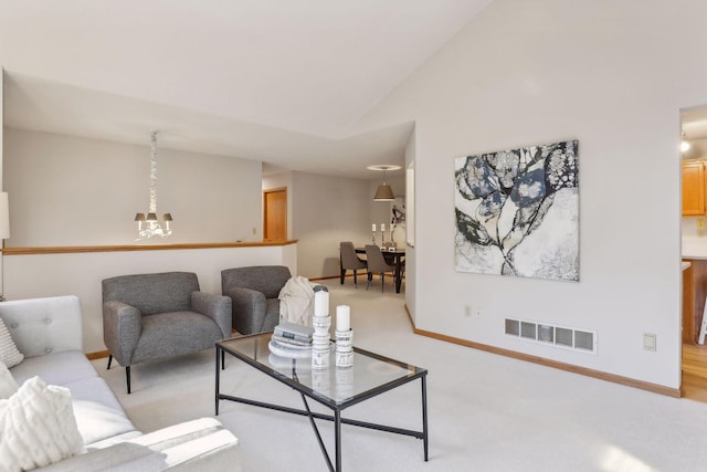 carpeted living room featuring lofted ceiling