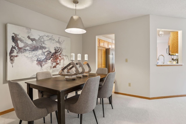 dining space with light colored carpet