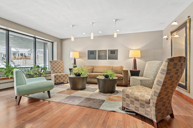 interior space with a textured ceiling and light wood-type flooring