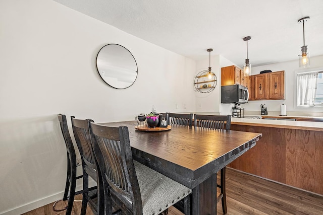 dining room with wood finished floors