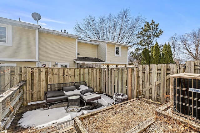 view of yard with central AC and a fenced backyard