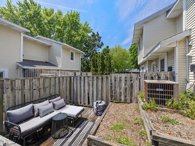 2028 Pathways Dr, Saint Paul, MN 55119 - fenced backyard with cooling unit, an outdoor hangout area, and a wooden deck