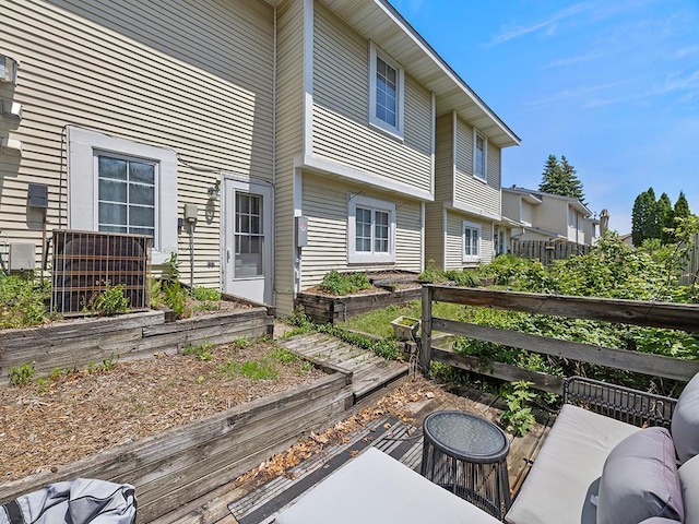 2028 Pathways Dr, Saint Paul, MN 55119 - wooden terrace featuring a vegetable garden