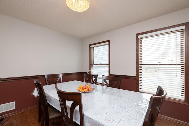 dining area featuring dark hardwood / wood-style floors