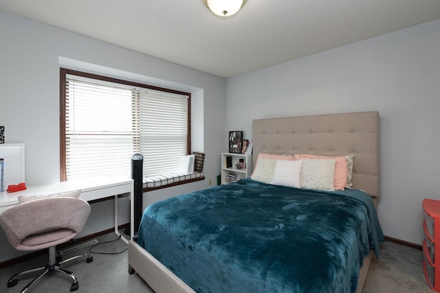 bedroom with carpet flooring and multiple windows