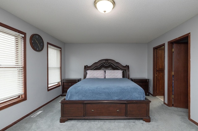 bedroom featuring light colored carpet