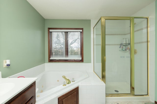 bathroom featuring vanity and separate shower and tub