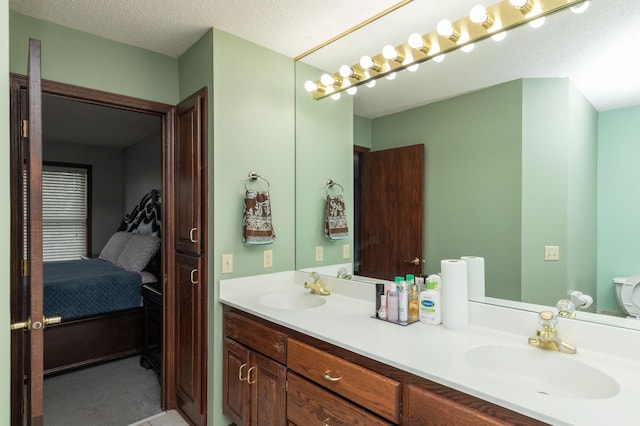 bathroom featuring vanity and a textured ceiling