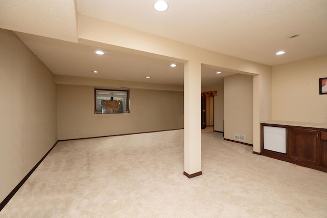 basement with light carpet