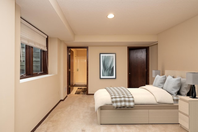 carpeted bedroom with a textured ceiling