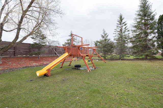 view of jungle gym featuring a lawn