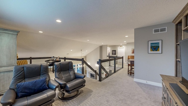 interior space featuring lofted ceiling and a textured ceiling