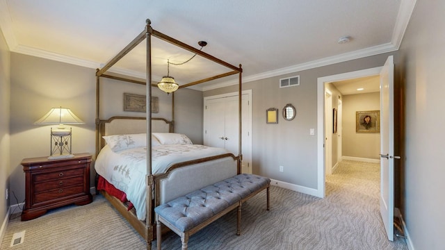 carpeted bedroom featuring ornamental molding and a closet