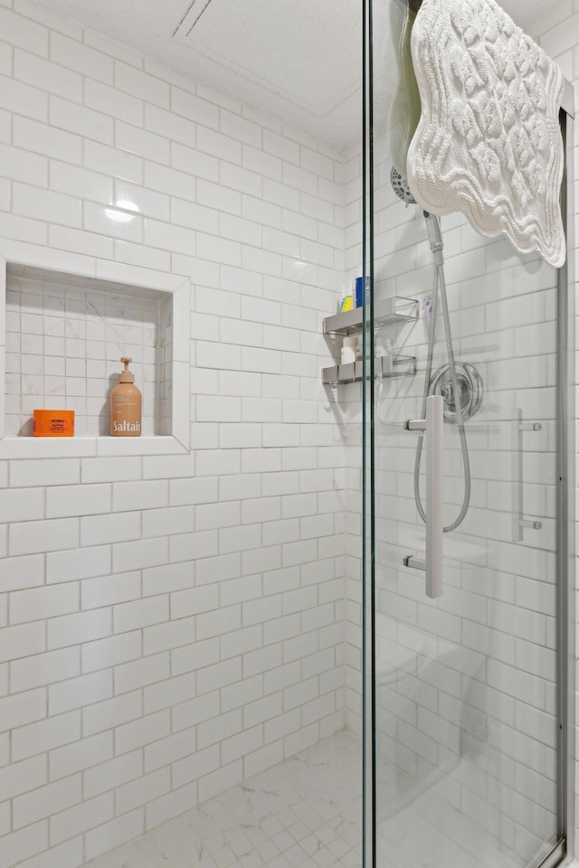 bathroom with a shower stall