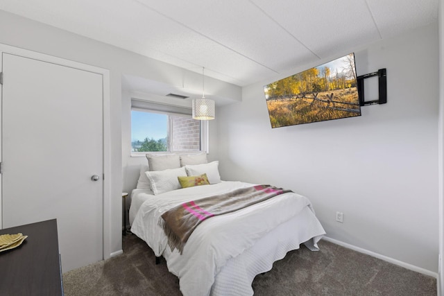 carpeted bedroom with baseboards and visible vents