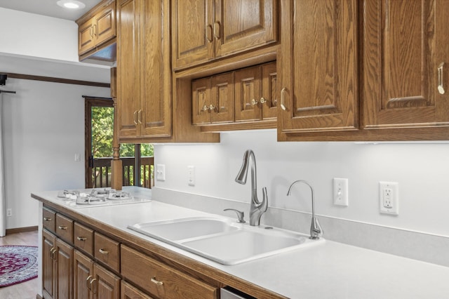 kitchen featuring sink and white gas cooktop