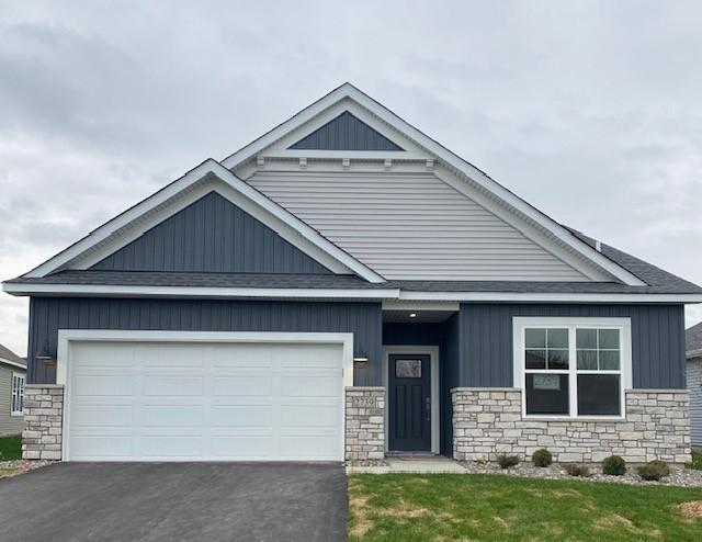 view of front of home featuring a garage and a front lawn