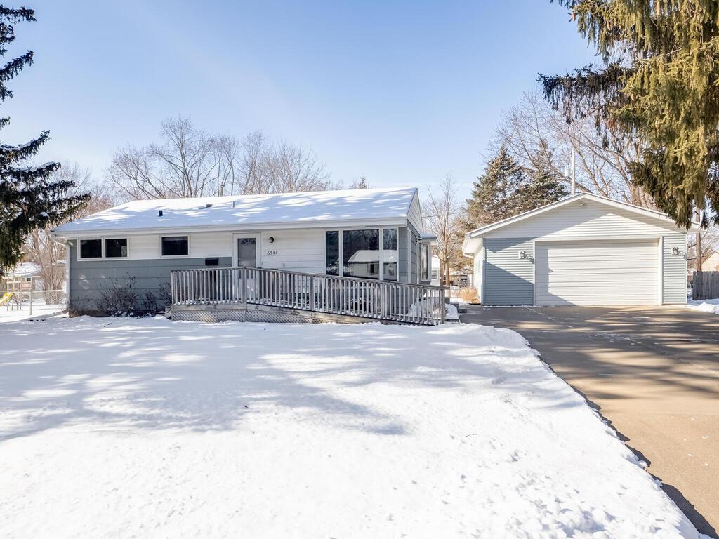 view of front of house featuring an outbuilding and a garage