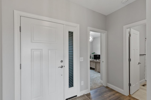 foyer entrance with wood-type flooring