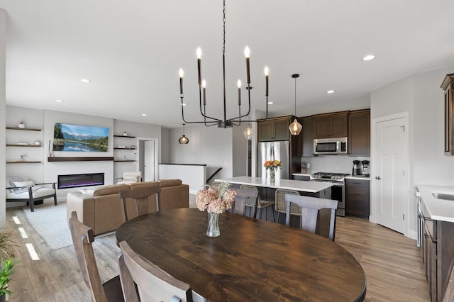 dining area featuring light wood-type flooring