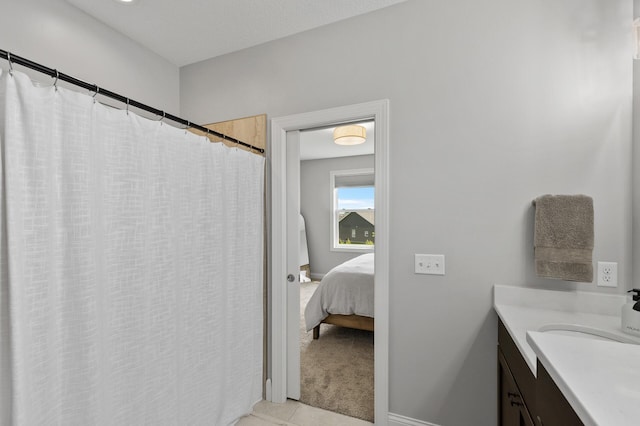 bathroom featuring vanity and tile patterned flooring