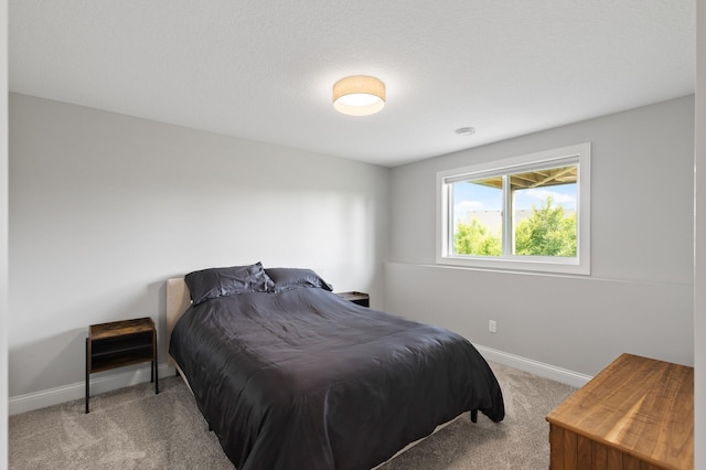 bedroom featuring light carpet