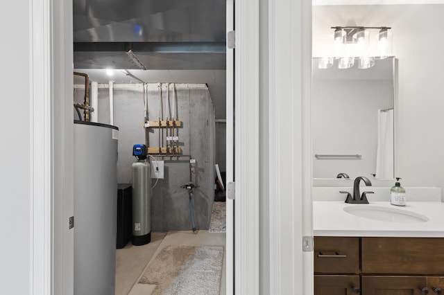 bathroom with water heater and vanity