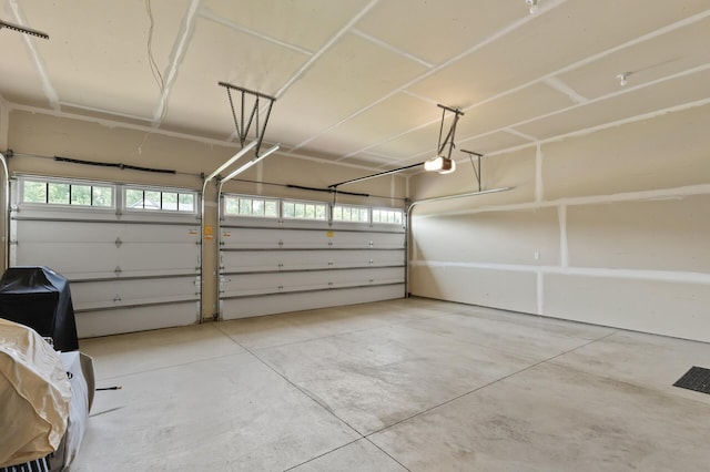 garage featuring a garage door opener