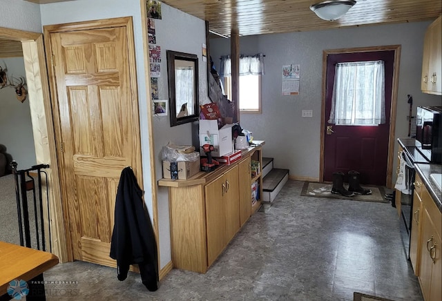 entryway featuring wood ceiling and a healthy amount of sunlight