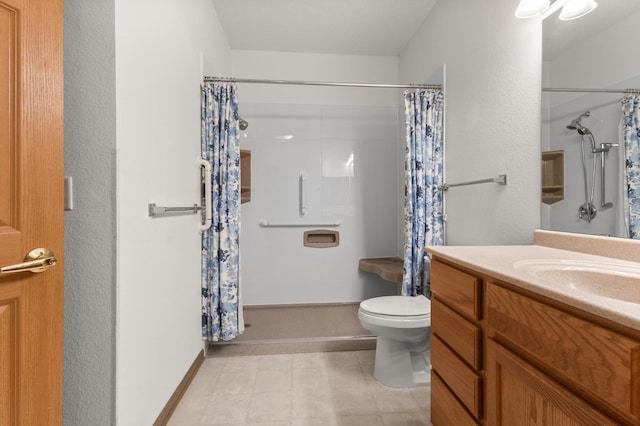 bathroom featuring vanity, curtained shower, and toilet