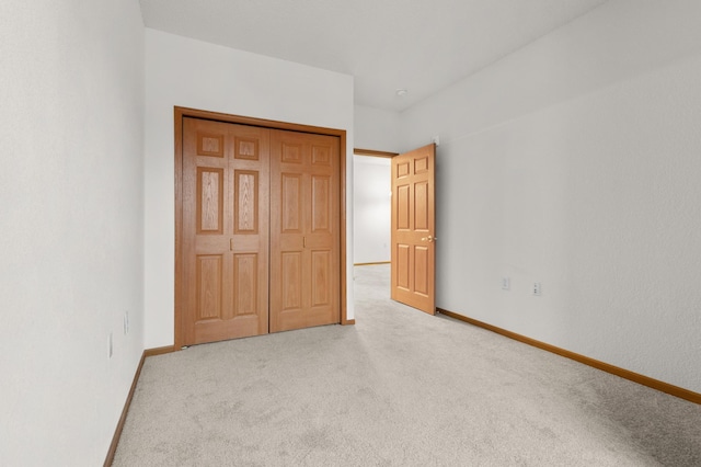 unfurnished bedroom with light carpet