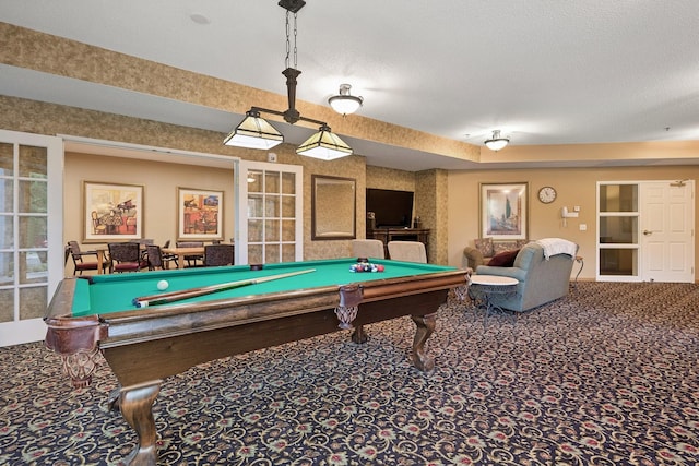 playroom featuring billiards, a textured ceiling, and carpet