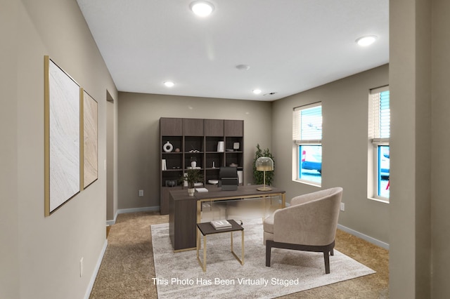 office area featuring recessed lighting, baseboards, and light colored carpet