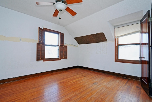 bonus room featuring lofted ceiling, wood-type flooring, and ceiling fan